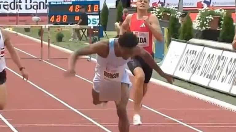 Athlete wins 400m hurdle race despite penis repeatedly falling out of shorts Athlete wins 400m hurdle race despite penis repeatedly falling out of shorts