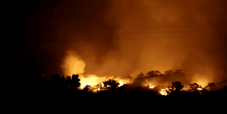 Mass evacuations in Crete as wildfire tears through popular holiday destination Mass evacuations in Crete as wildfire tears through popular holiday destination