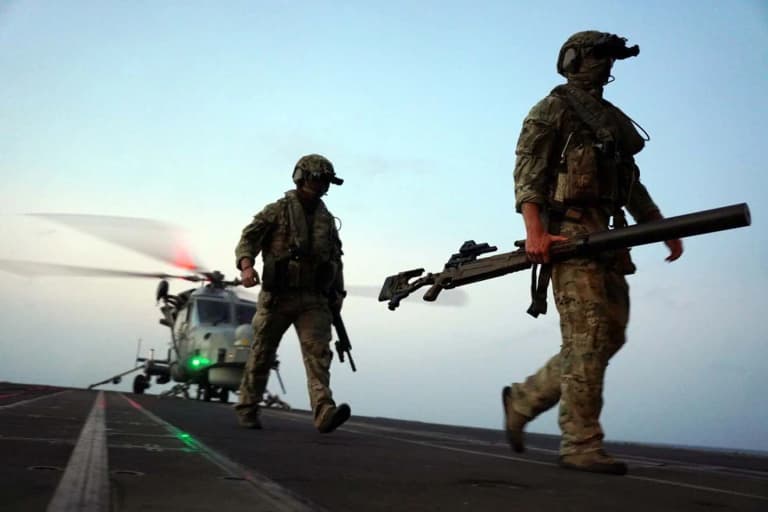 Royal Marine sniper thwarts £35m drug haul with single bullet from a helicopter Royal Marine sniper thwarts £35m drug haul with single bullet from a helicopter