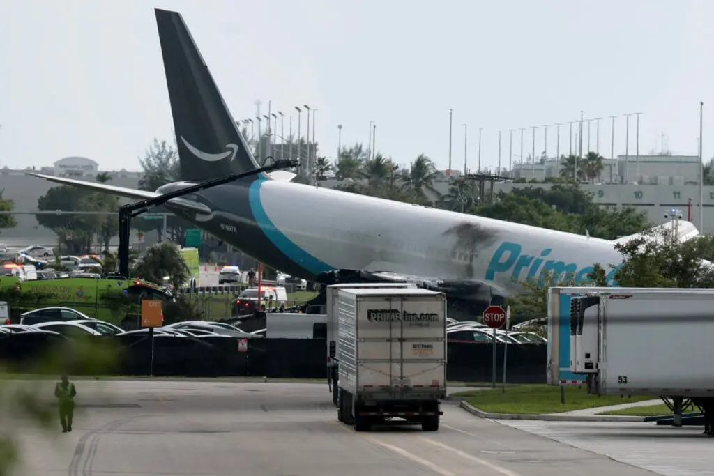 Major US airport closed after Amazon cargo plane overshoots runway hitting multiple vehicles