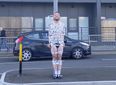 Semi-naked groom taped to traffic light in hilarious stag do prank