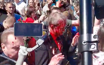 Russian ambassador left red-faced after being attacked with paint by crowd shouting ‘fascist’