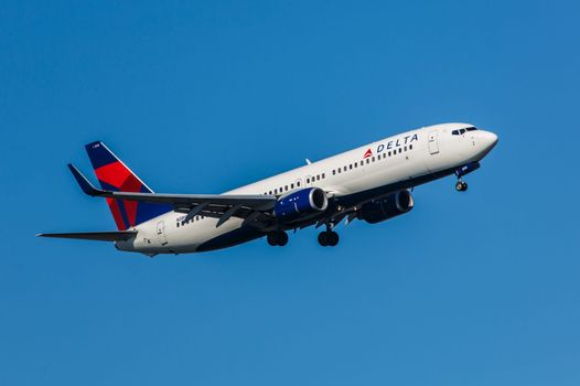 New York, USA - April 30, 2012: Boeing 737 Delta Air Lines approaches John F. Kennedy International Airport in New York, NY on April 30, 2012. Delta is the oldest airline still operating in the United States.