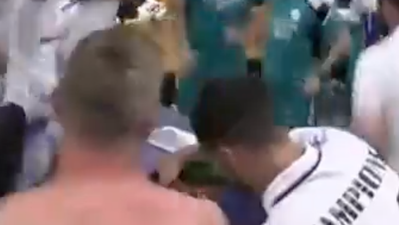 Toni Kroos stops Eden Hazard pouring champagne for son during celebrations