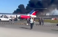 Shocking moment plane crash-lands at Miami Airport and bursts into flames