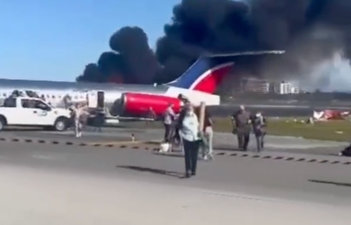 Shocking moment plane crash-lands at Miami Airport and bursts into flames