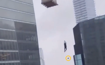 Terrifying video shows screaming construction worker dangling from crane hundreds of feet in the air