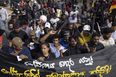 Thousands of protestors in Sri Lanka storm Presidential palace, with some using the pool