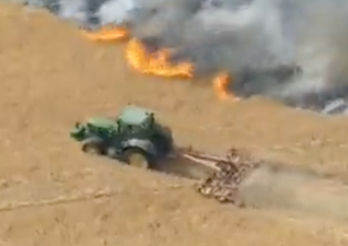 Moment heroic farmer desperately tries to slow down wildfire to save his neighbour’s home