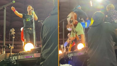 Chris Martin invites Ukrainian busker on stage to play at sold-out Coldplay gig in Poland