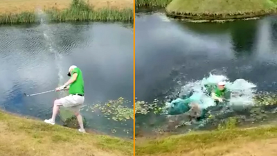 Golfer attempts to play lake-side ball as it lies – ends up spectacularly falling in the drink