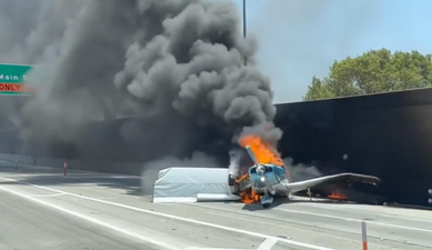 Unbelievable moment plane crash lands on California highway before bursting into flames
