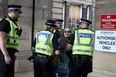 Woman with ‘abolish monarchy’ sign charged with offence after arrests of republican protesters