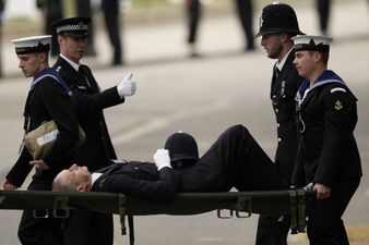 Police officer collapses and carried away on stretcher during Queen’s funeral