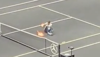 Protestor sets arm on fire after invading tennis court during Laver Cup