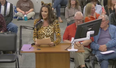 Mum dresses as cat in protest against trans member of school board