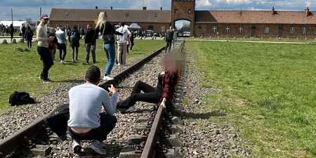 Woman sparks outrage after posing for photos on Auschwitz train tracks