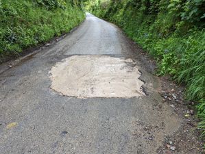 Officials search for mystery motorist who filled huge pothole with concrete