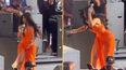 Cardi B throws microphone at fan who launched drink at her