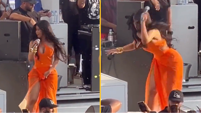Cardi B throws microphone at fan who launched drink at her