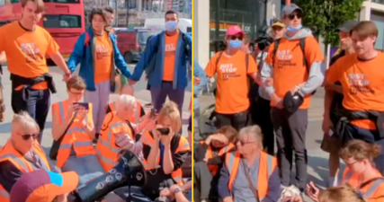Just Stop Oil activists surrounded by Just Stop P*ssing Everyone Off group to prevent march