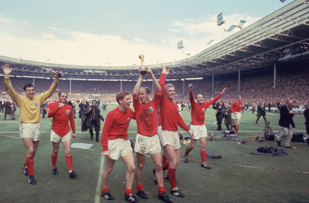 Bobby Charlton raises the World Cup in the air following England's 4-2 victory over West Germany in 1966 (Getty)