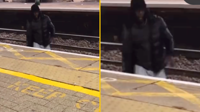 Outrage as man climbs over live train tracks to harass lone woman at station