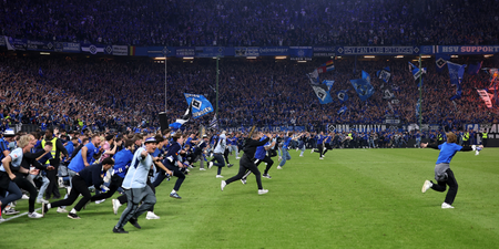 Huge pitch invasion sees 25 fans rushed to hospital